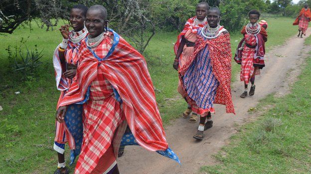 Maasai women walking to the protest meeting
