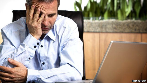 Generic image of a man looking exasperated at his laptop computer