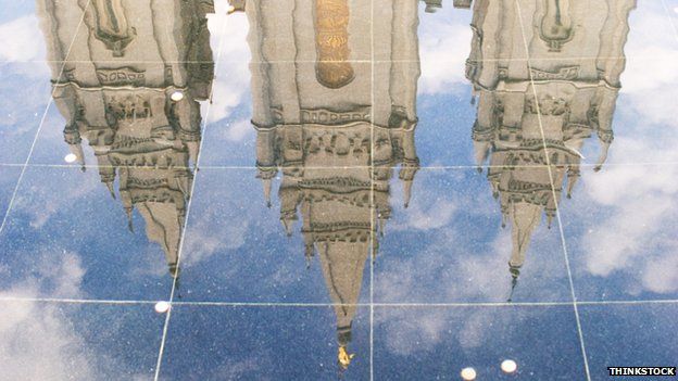 The reflection of a Mormon Temple on a shiny floor