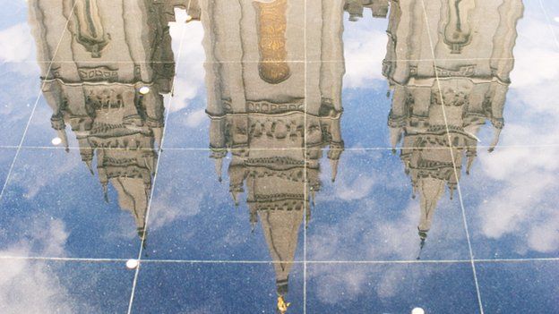 The reflection of a Mormon Temple on a shiny floor