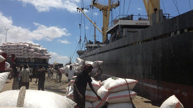 Workers load ship in Mogadishu