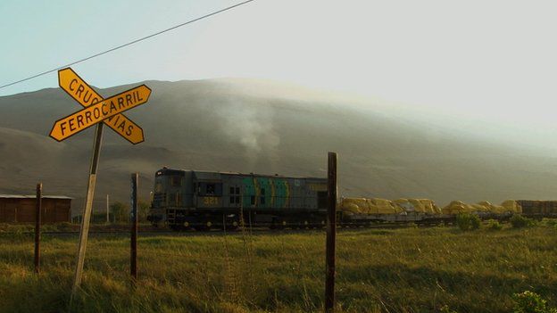 A freight train at a railway crossing on the Arica-La Paz railway (file photo)