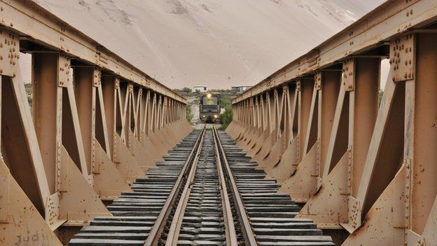 A train approaches a bridge on the Arica-La Paz railway (file photo)