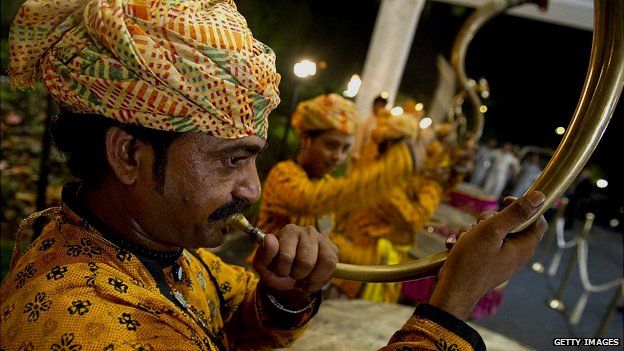 Man playing traditional Punjabi horn