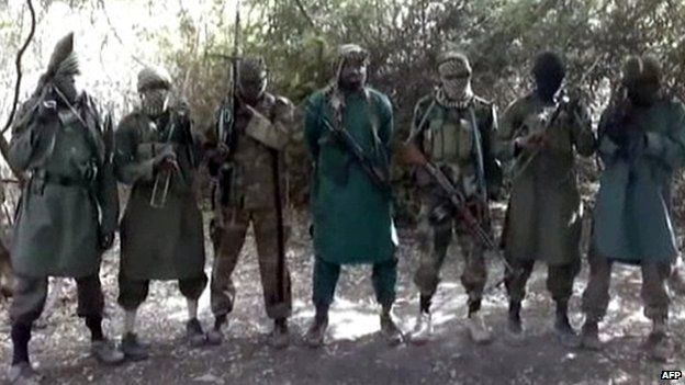 A picture taken from a video distributed to Nigerian journalists in the country's north and obtained by AFP on March 5, 2013 reportedly shows Abubakar Shekau (C), the suspected leader of Nigerian Islamist group Boko Haram