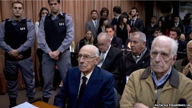 Former dictators Jorge Rafael Videla, second from right, and Reynaldo Bignone, right, wait to listen the verdict of Argentina's historic stolen babies trial in Buenos Aires, Argentina, Thursday, July 5, 2012. (AP Photo/Natacha Pisarenko)