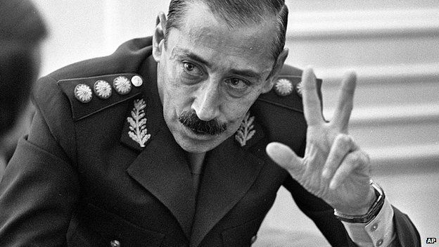 Jorge Rafael Videla talks to journalists at the Buenos Aires Government Palace in 1978