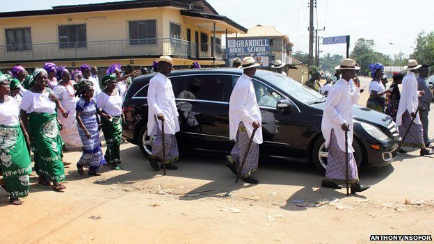 Car taking deceased for burial at an Igbo funeral in Nigeria