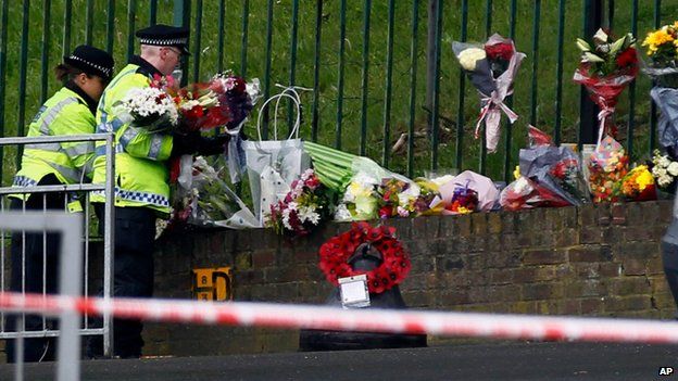 Police lay floral tributes