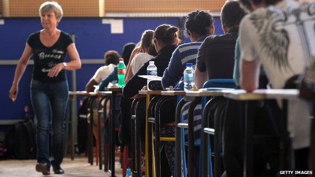 French students work on the test of Philosophy as they take the baccalaureat exam