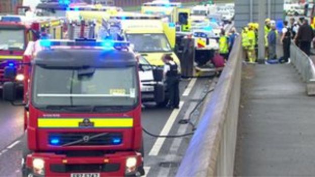 Police Land Rover overturns in Westlink crash - BBC News