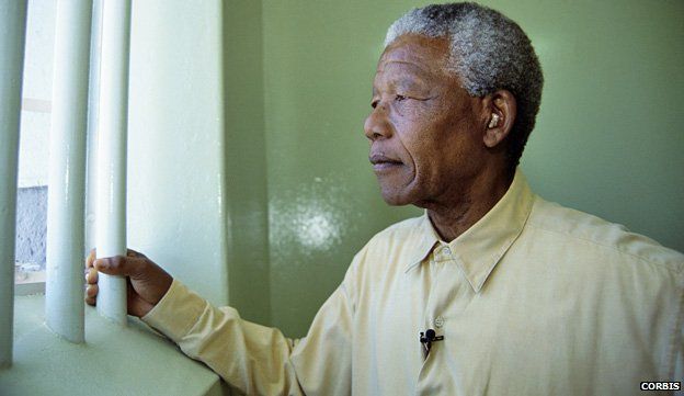 Nelson Mandela revisiting his prison cell in 1994