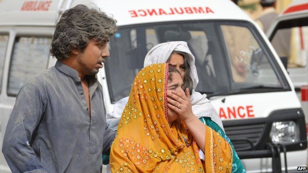 Civilians emerge from the hospital attacked in Quetta, Pakistan, 15 June