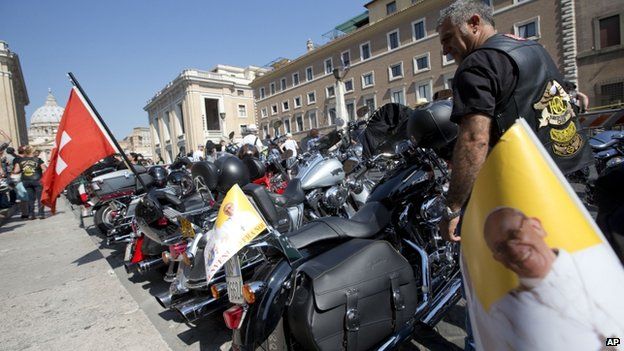 Harley Davison bikes stand parked on St Peter's Square, 16 June