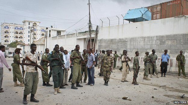 Somali government soldiers gather in front of the UN compound - 19 June 2013