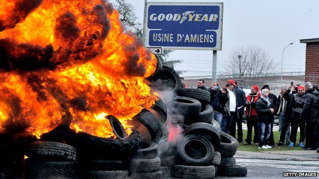 Workers burn tyres at the Goodyear factory in Amiens, France
