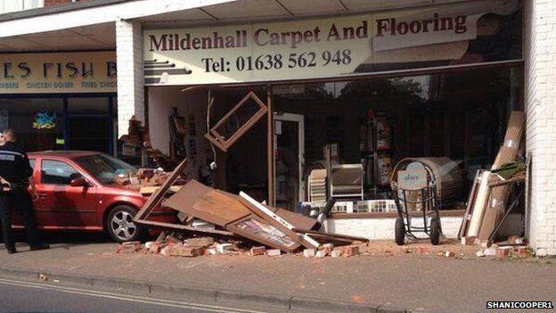 Car Crashes Into Mildenhall Shop And Misses Woman By Inches Bbc News