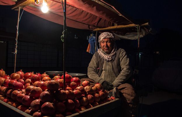 A man selling pomegranates