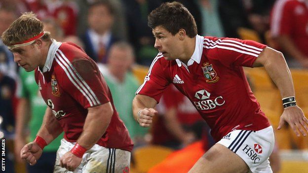 Tom Youngs (L) and his brother Ben Youngs in action for the Lions