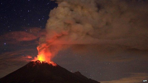Ash spew from Mexico's Popocatepetl volcano, seen from San Mateo Ozolco, in the Mexican central state of Puebla, on 4 July