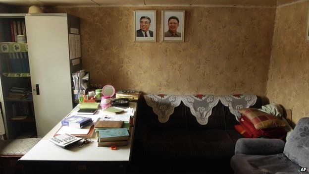 Portraits of late North Korean leaders Kim Il-sung and Kim Jong-il decorate an office aboard a North Korean-flagged ship