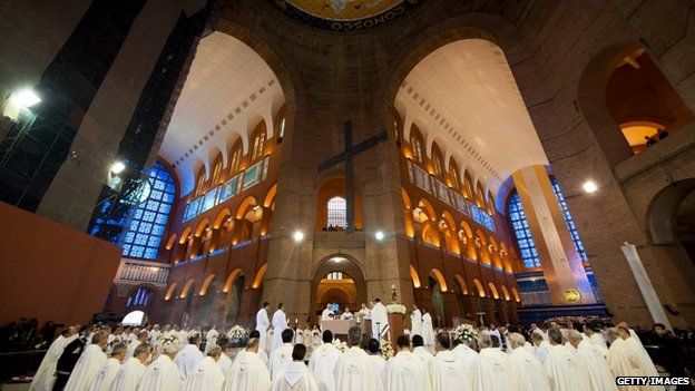 Priests gather around Pope Francis as he celebrates Mass at the Basilica of the Shrine of Our Lady Aparecida on July 24, 2013 in Aparecida, Brazil