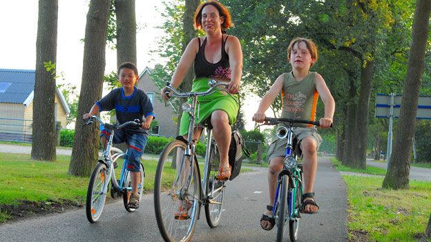 Dutch mother and boys cycling