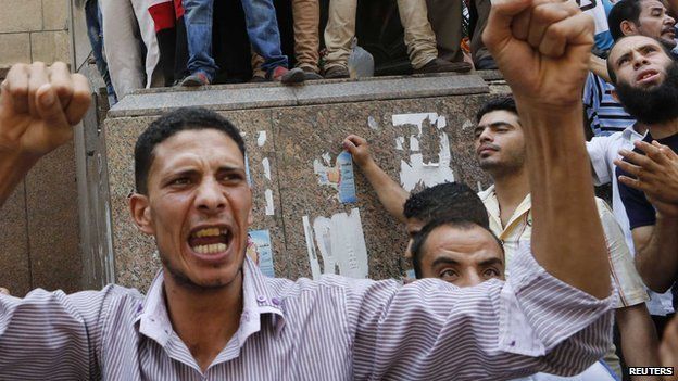 A supporter of deposed President Mohammed Morsi takes part in protest near Ennour Mosque in Cairo, 16 August 2013
