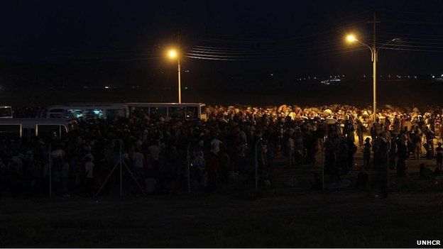 Night-time shot of new refugees arriving at the makeshift reception in Iraqi Kurdistan