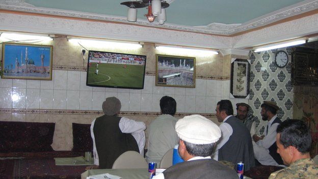 Afghan fans watch the game in a Kabul cafe