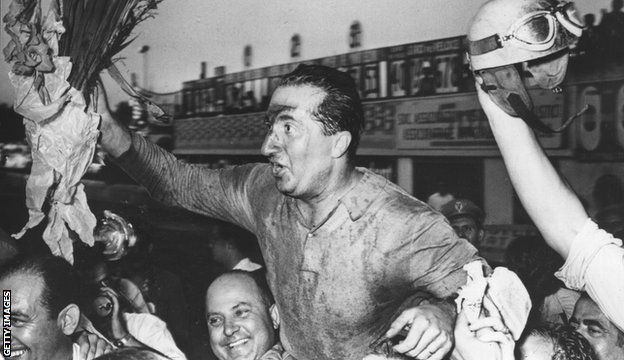 Ferrari driver Alberto Ascari is hoisted aloft by fans after winning at Monza in 1951