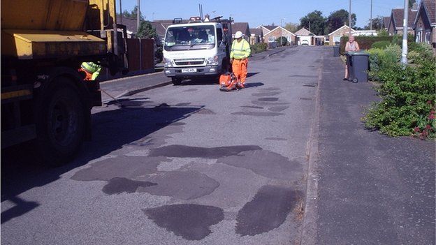 Potholes being repaired in Conway Drive, North Hykeham