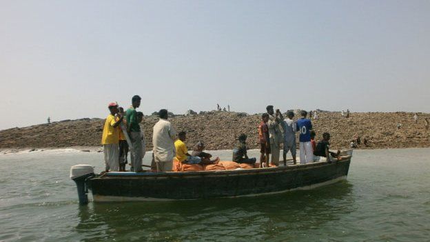 A boat near an island that appeared two kilometres off the coastline of Gwadar on 25 September, 2013.