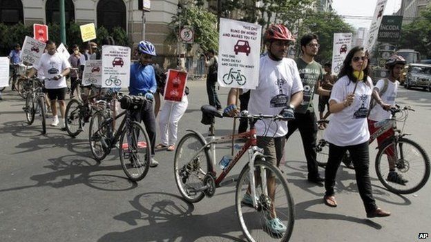 Activists march with bicycles and posters during an awareness rally on environment friendly non-polluting transport in Kolkata, India, Sunday, Sept. 8, 2013. The activists demanded that the authorities withdraw the restrictions on cycles and other non-motorized transport in Kolkata’s main streets