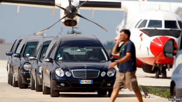 Hearses at Lampedusa's airport on 4 October 2013
