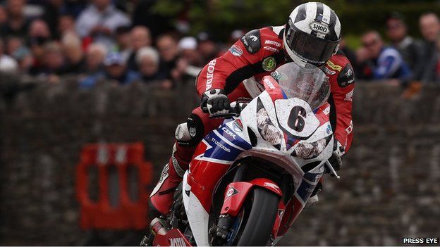 Race winner Michael Dunlop pictured onboard his Superbike powering through St Ninian's crossroads