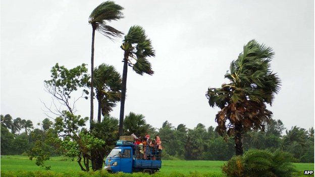 Indian villagers seeking shelter from Cyclone Phailin, 12 October 2013