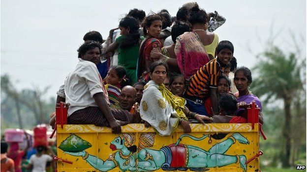 Villagers ride back to Sonupur, near Gopalpur, 13 October 2013