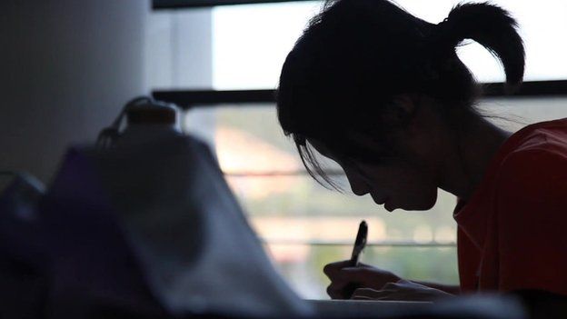Shot of female student writing taken in October 2013