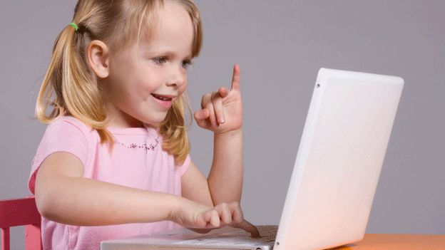 Young girl using laptop