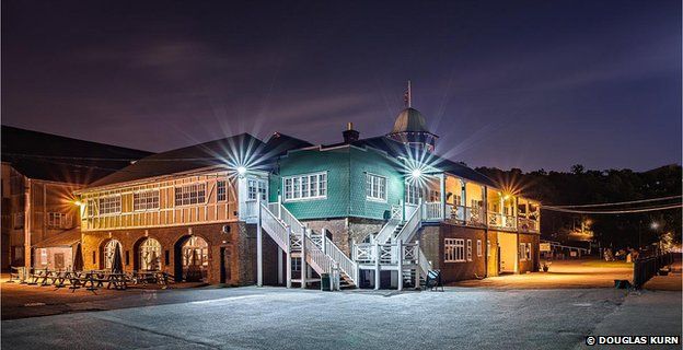 The Brooklands Clubhouse at night.