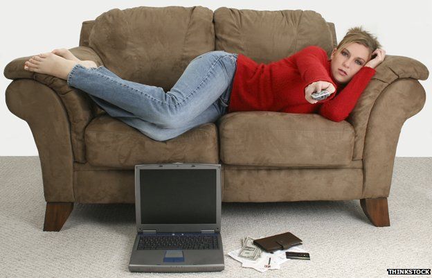 Woman with laptop on sofa