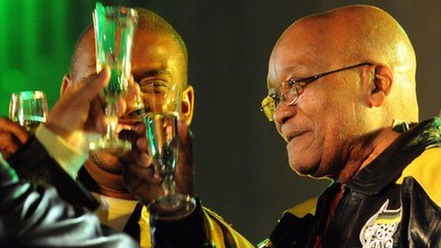 South Africa's President Jacob Zuma toasts at a street party in Johannesburg on 23 April 2009