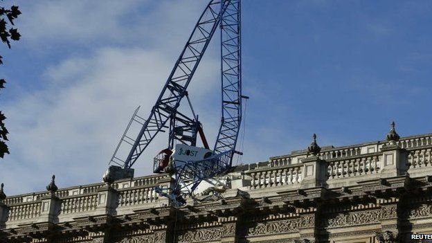 A crane on the roof of the Cabinet Office in London has collapsed