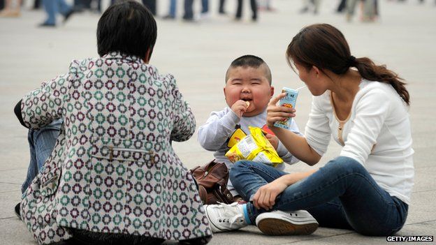 A family visiting Tiananmen Square - file pic, Sep 2012