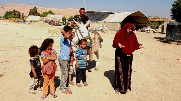 Jamilla Adeis (right) with family in village of Abu al-Ajaj