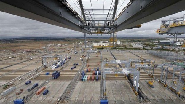 The arm of a crane stretches over the DP World London Gateway container port in Essex