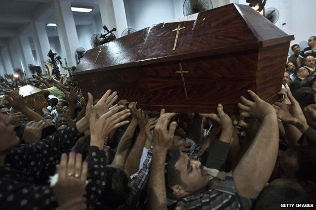 Mourners carrying coffins in Egypt