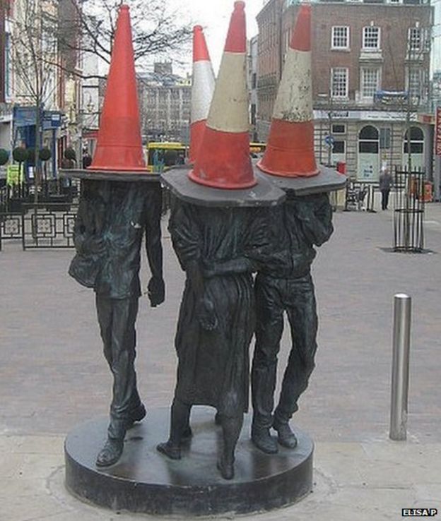 Why do people put traffic cones on statues? BBC News