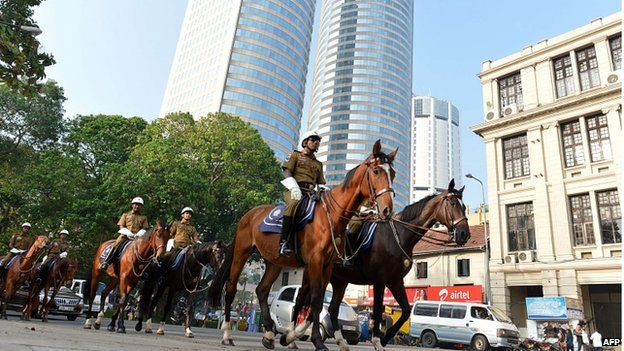 Sri Lankan traffic policemen on horseback patrol a street in Colombo on November 14, 2013, ahead of the Commonwealth Heads of Government (CHOGM) meeting.